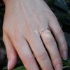 Delicate-diamond-half-way-wedding-band-by-OroSpot.jpg