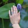 Stackable-diamond-and-sapphire-bands-on-a-hand-by-OroSpot-scaled-1.jpg