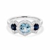 Three-halo-aquamarine-and-sapphire-ring.jpg
